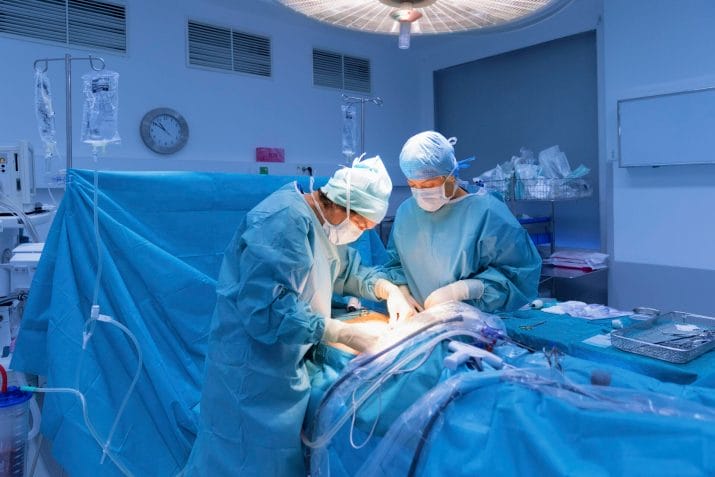 Surgeons performing surgery in operating Theater.